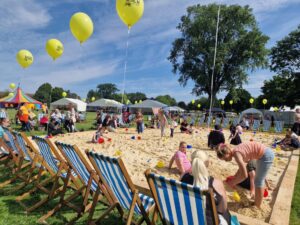 Northfield Beach events with image of children and adults enjoying the sand